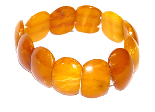 antikes Einzelstück, Armband aus cognacfarbenem alten Bernstein in ovalen Plättchen auf flexiblem Gummi aufgereiht, Innenumfang ca. 17 cm, um 1930 - Vintage-Schmuck nur im Onlineshop von danilogold!