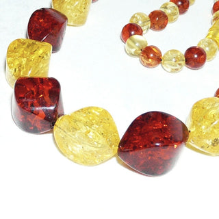 Einzelstück, opulente, mehrfarbige, handgefertigte Bernstein-Kette aus großen polierten, angeschliffenen Oliven + zum Ende hin kleineren Kugeln im Verlauf, ungeknotet, in warmen honig-rotbraun + strahlendem hellgelb, schöne, funkelnde Einschlüsse, Dreh-Verschluß, Gesamtlänge 62 cm -	Handgefertigtes Unikat! Nur im Onlineshop von Juwelier & Goldschmiede Danilo!