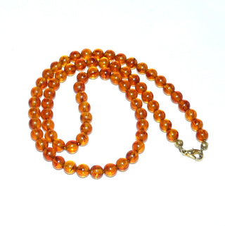 Einzelstück, Bernstein-Kugel-Kette aus polierten Kugel in einem mittleren Cognac-orange, gleichlaufend, feine dezente Einschlüsse, ungeknotet, Verschluß aus Gold-Doublé, Gesamtlänge 45 cm -	Nur erhältlich im Onlineshop von Juwelier & Goldschmiede Danilo!
