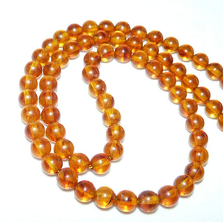 Einzelstück, Bernstein-Kugel-Kette aus polierten Kugel in einem mittleren Cognac-orange, gleichlaufend, feine dezente Einschlüsse, ungeknotet, Verschluß aus Gold-Doublé, Gesamtlänge 45 cm -	Nur erhältlich im Onlineshop von Juwelier & Goldschmiede Danilo!