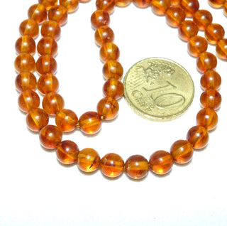 Einzelstück, Bernstein-Kugel-Kette aus polierten Kugel in einem mittleren Cognac-orange, gleichlaufend, feine dezente Einschlüsse, ungeknotet, Verschluß aus Gold-Doublé, Gesamtlänge 45 cm -	Nur erhältlich im Onlineshop von Juwelier & Goldschmiede Danilo!