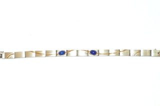 Einzelstück, Unikat-Glieder-Armband aus 925 Silber mit 2 ovalen Lapislazuli-Cabochons, seidenmatte rechteckige Glieder mit Stiftbewegung + bogenförmigen Belötungen mit polierten750 Goldstreifchen, Kastenschloß, Länge 17,5 cm -	Unikatschmuck nur erhältlich im Onlineshop von Juwelier & Goldschmiede Danilo! 