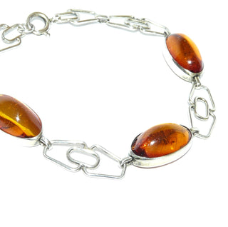 Vintage-Einzelstück, Bernsteinarmband aus 830 Silber mit transparentem honigfarbenen Bernstein in langovalen Cabochons, klar, fast ohne Einschlüsse, Länge 20cm, Federringverschluß, Art Deco 1930-1935 - Goldschmiede Danilo