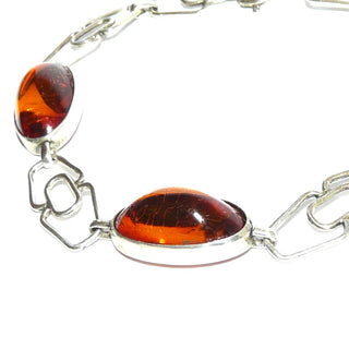 Vintage-Einzelstück, Bernsteinarmband aus 830 Silber mit transparentem honigfarbenen Bernstein in langovalen Cabochons, klar, fast ohne Einschlüsse, Länge 20cm, Federringverschluß, Art Deco 1930-1935 - Goldschmiede Danilo