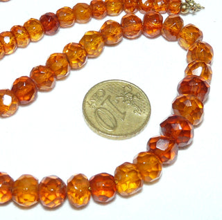 handgeschliffenes Einzelstück, antike Vintage-Bernstein-Kette aus polierten dicken Linsen-Nuggets im funkelnden Königsberger Facettenschliff, Verlauf von 6 mm auf 10 mm Durchmesser, mittleres Cognac-braun, ungeknotet, mit einem Verschluß aus Gold-Doublé, Gesamtlänge 42 cm, Art Deco um 1920 -	Vintage-Schmuck nur im Onlineshop von danilogold!