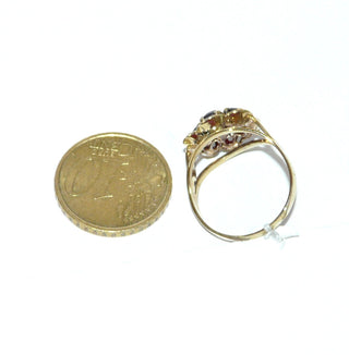 Vintage-Einzelstück, Granatring "Blume" aus 333 Gold mit 7 runden, facettierten Granaten im Altschliff, runde Rosette mit Bogenkranz, Krappenfassungen, Ringweite 52, Manufakturarbeit später Historismus um 1900-1910 Goldschmiede Danilo