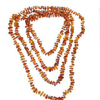 handgeknüpftes Einzelstück, superlange Bernstein-Kette aus polierten, abgerundeten Chips /&nbsp; mittleres Cognac-orange, durchgeknotet, ohne Verschluß, Gesamtlänge 220 cm, kann mehrfach um den Hals gelegt werden, um daraus eine 2- oder 3-reihige Optik zu erzielen - Nur erhältlich im Onlineshop von Juwelier & Goldschmiede Danilo!
