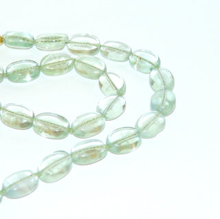 hellgrünes Einzelstück, Edelsteinkette aus klarem transparenten pastellgrünen Fluorit in flachen Ovale ca. 10mm x 13,5mm, Verschluß aus Gold-Doublé Karabiner, Länge 45cm, Seide geknotet - Goldschmiede Danilo