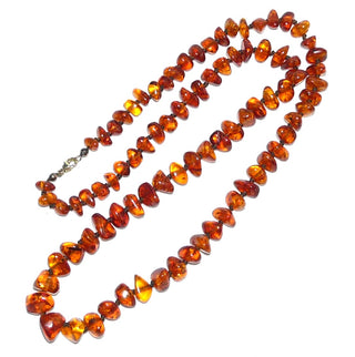 Handpoliertes Einzelstück, Bernstein-Kette aus dicken polierten Linsen-Nuggets, im Verlauf durchgeknotet, mittleres Cognac-orange mit schönen Einschlüssen, Verschluß aus Gold-Doublé, Gesamtlänge 74 cm -	Handgefertigter Schmuck nur erhältlich bei www.danilogold-shop.de 
