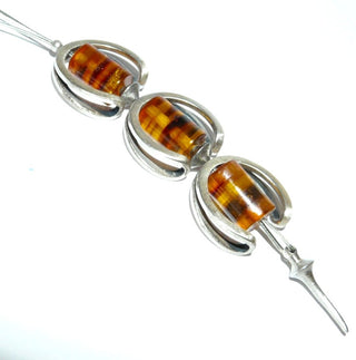 doppelreihiges Einzelstück, Y-Collier, Mittelteilcollier, Unikat Bernsteinkette, doppelte, ummantelte Stahlseide 70cm & 9 cm gebänderte Tönnchen in Honig-Braun, ummantelter Stahlseide & Mittelteil aus 925 Silber C-Bögen & Silberverschluß - Goldschmiede Danilo