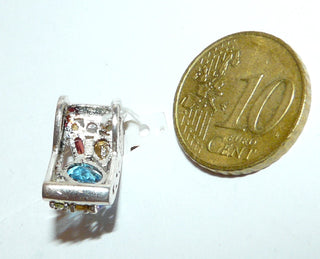 Einzelstück, multicolor Anhänger aus 925 Silber mit funkelnden farbigen facettierten Edelsteinen in unterschiedlichen Schliffformen: Amethyst, Citrin, Granat, Blautopas, Olivin, Bergkristall. Offen verarbeitet mit verdeckter Öse zum Durchfädeln. Seitenflächen ornamental Ausgesägt (Lieferung erfolgt ohne Kette) -	Nur erhältlich bei www.danilogold-shop.de