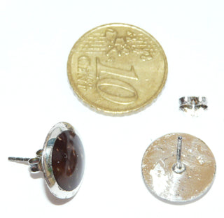 Einzelstücke, Ohrstecker "Coconut" aus 925 Silber mit einem Durchmesser von 14 mm, ein breiterer, polierter Silberrand umschließt das als Cabochons geschliffene dunkelbraune Kokosnuß-Holz mit schöner Maserung -	Nur erhältlich im Onlineshop von Juwelier & Goldschmiede Danilo!